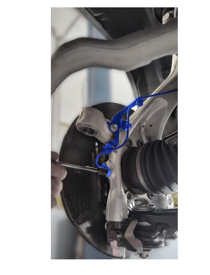 Remove ABS sensor — take care not to crush cable