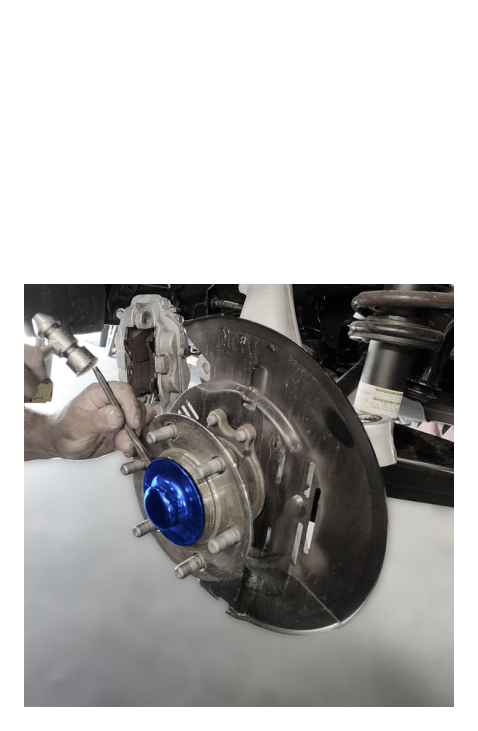 Remove brake calipers — save caliper bolts