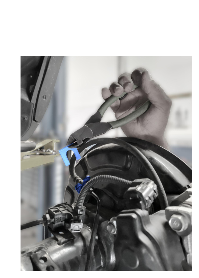 Remove rear brake line retaining clip — save clip
