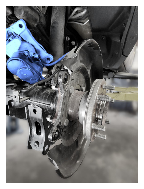 Rear brake caliper removed