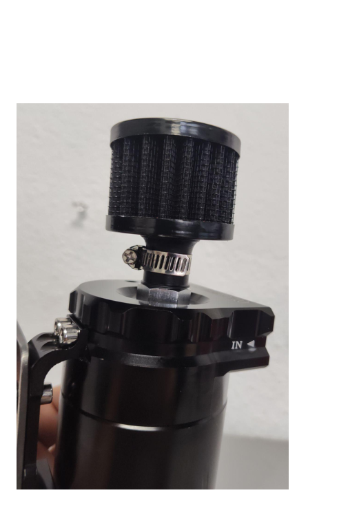 Thread small hose barbs (with Teflon tape) into forward-facing ports — install dipstick