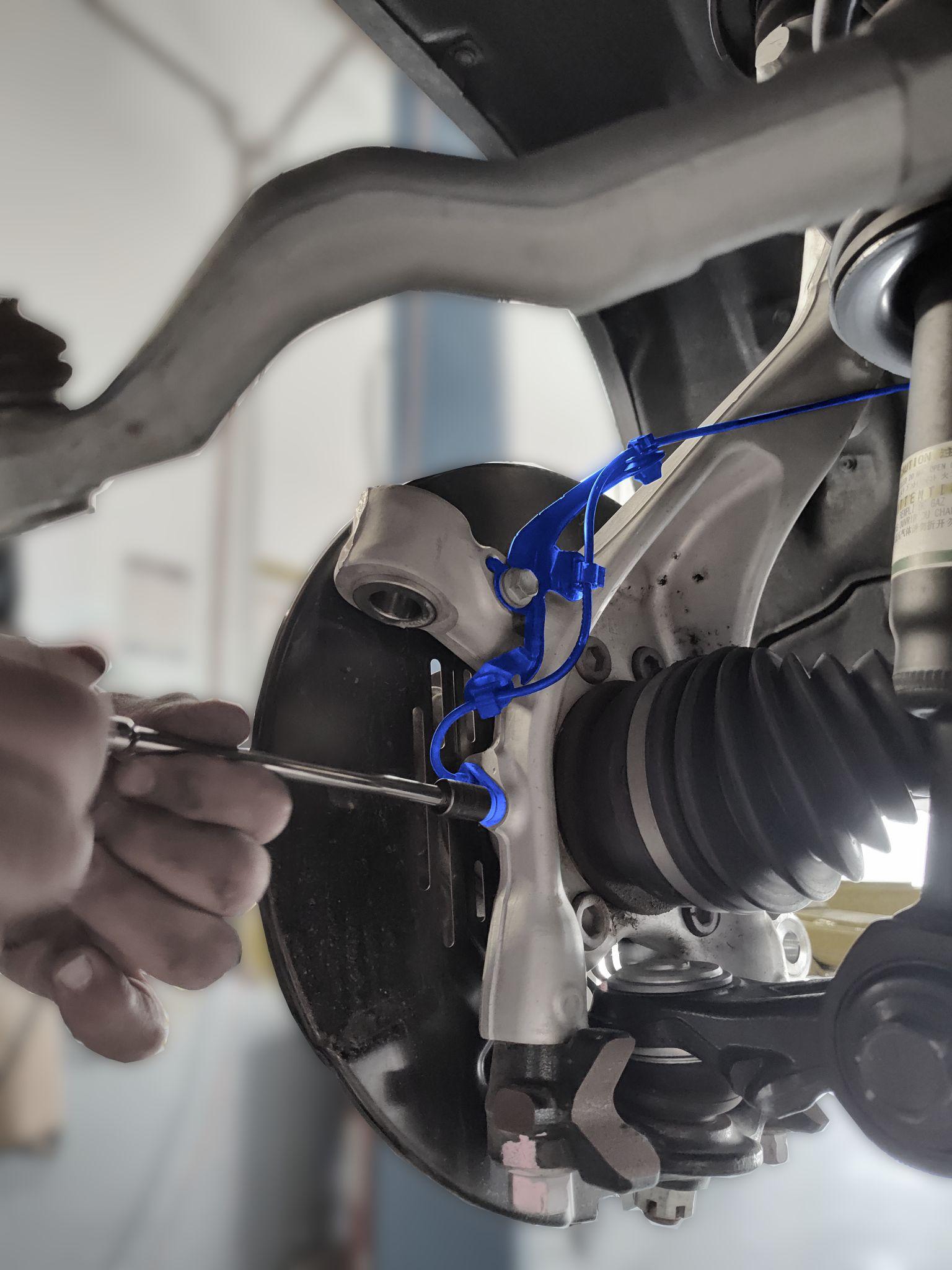 Brake bracket installation step 2 — loctite application