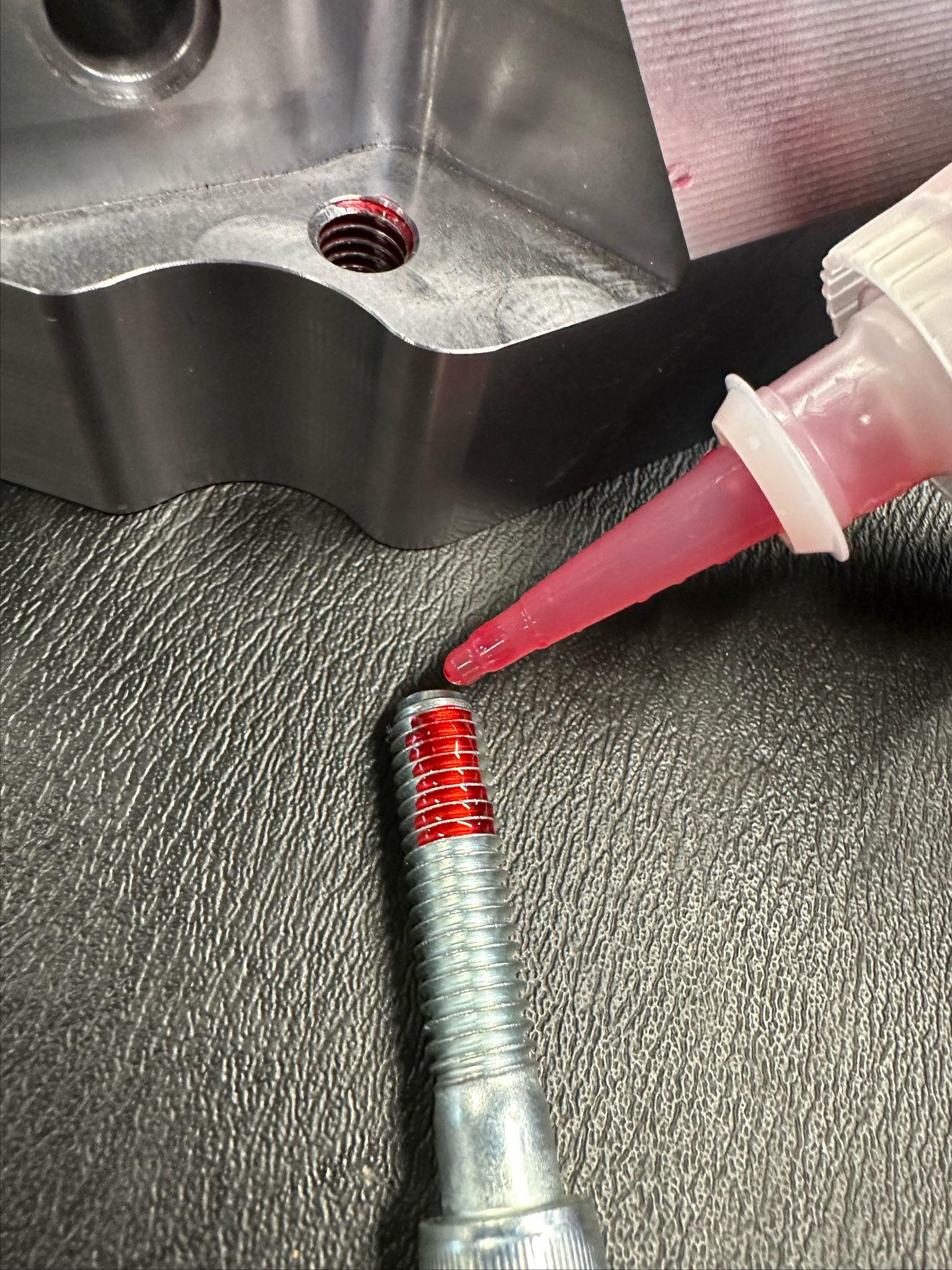 Rear brake caliper bolt location