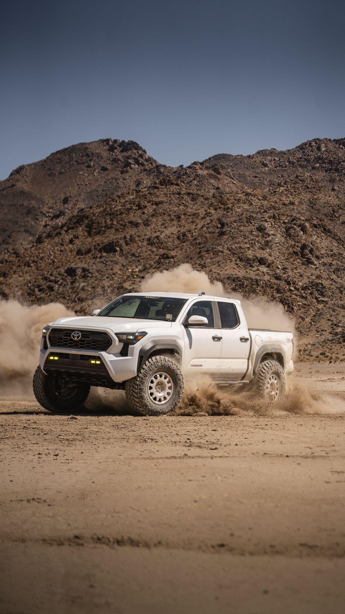 74Weld Toyota Portals — white Toyota Tacoma in desert